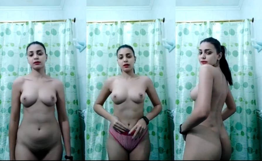 Young girl with a beautiful body design and fingering herself.